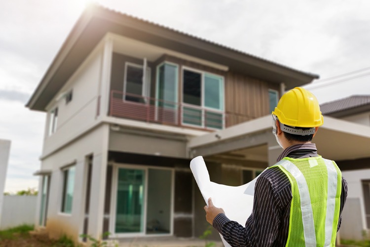Baron Construction builder reviewing plans at a Los Angeles residence
